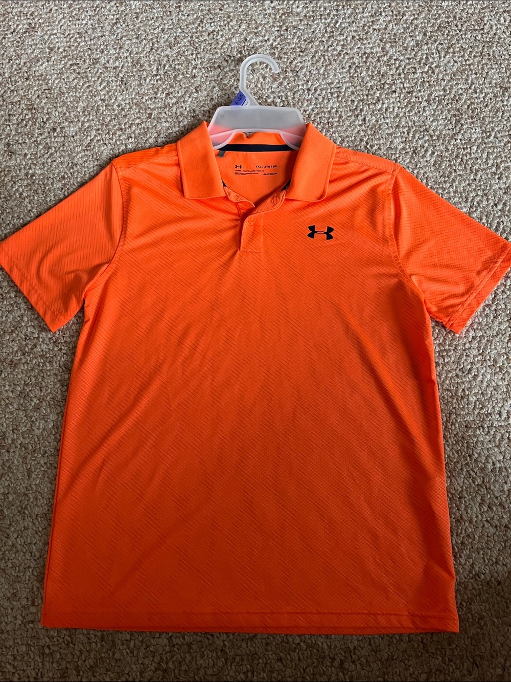 Under Armour Boys Bright Orange Polo with Navy blue symbol